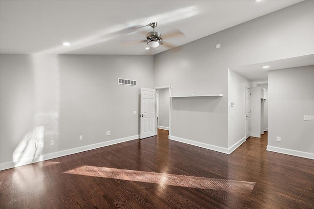 empty room featuring ceiling fan, dark hardwood / wood-style flooring, and lofted ceiling