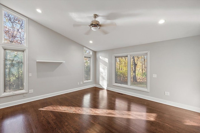 unfurnished living room featuring ceiling fan, wood-type flooring, and vaulted ceiling