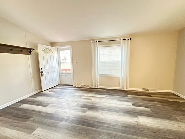 206 Crane St, Union City, MI 49094 - unfurnished room with wood finished floors, lofted ceiling, and baseboards