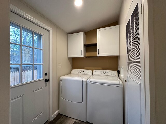 206 Crane St, Union City, MI 49094 - laundry area with cabinet space, independent washer and dryer, dark wood-style flooring, and a heating unit