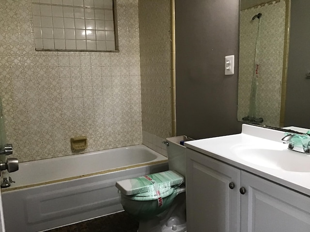 bathroom with vanity and tiled shower / bath combo