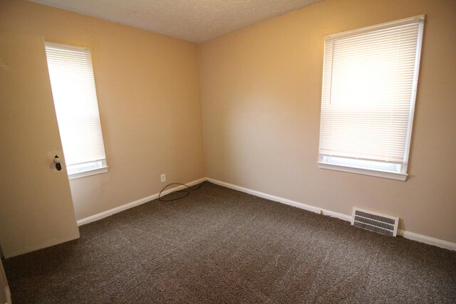 20253 Washtenaw St, Harper Woods, MI 48225 - carpeted empty room featuring baseboards