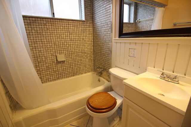 20253 Washtenaw St, Harper Woods, MI 48225 - bathroom featuring healthy amount of natural light, shower / tub combo with curtain, toilet, and vanity