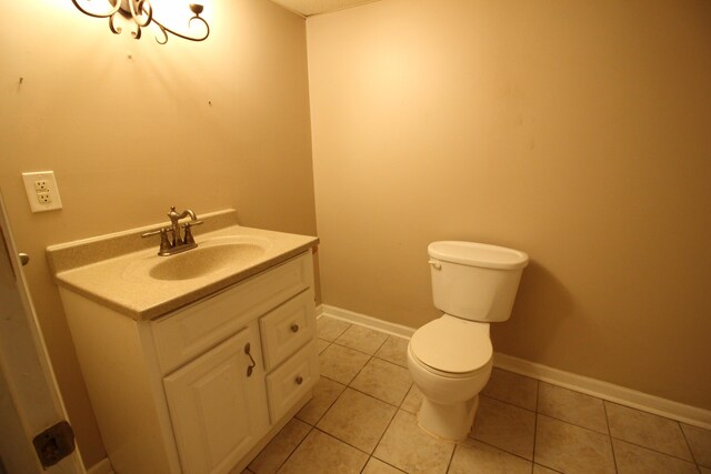 20253 Washtenaw St, Harper Woods, MI 48225 - bathroom with toilet, vanity, tile patterned flooring, and baseboards