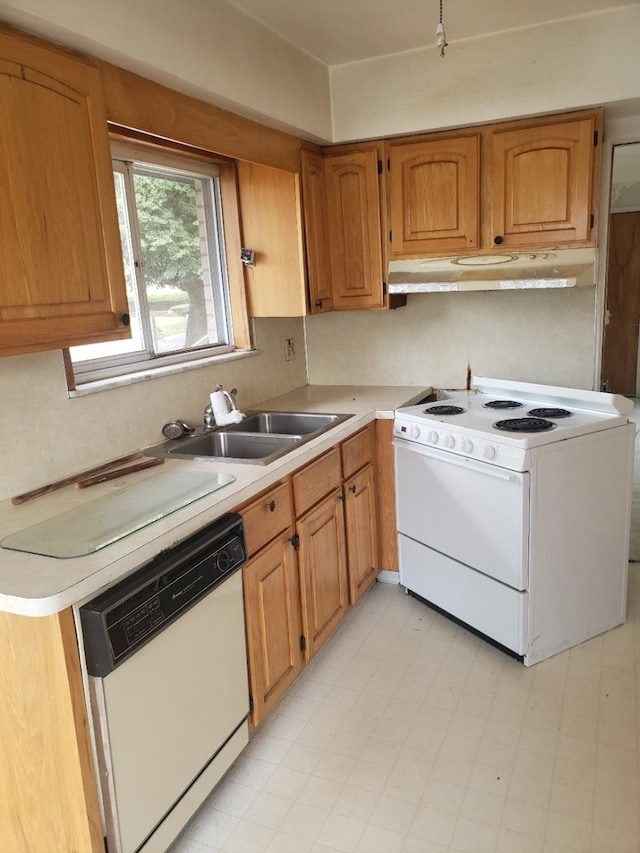 kitchen featuring sink and white appliances