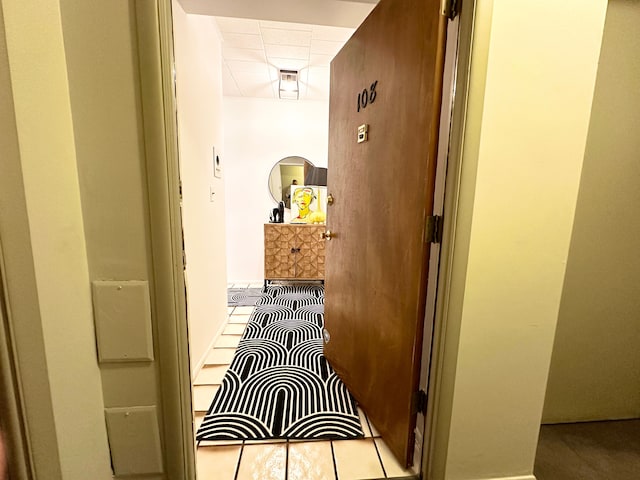 corridor with light tile patterned flooring