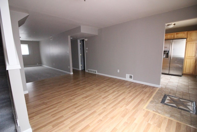 16117 Jackson St, Taylor, MI 48180 - unfurnished living room featuring light wood-style flooring and baseboards