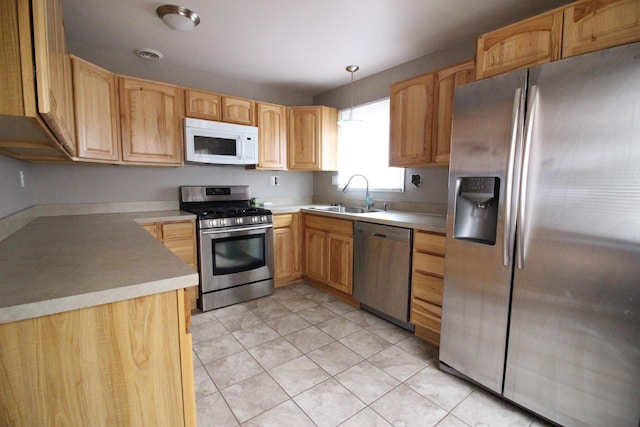 16117 Jackson St, Taylor, MI 48180 - kitchen with appliances with stainless steel finishes, a sink, light tile patterned floors, pendant lighting, and light countertops