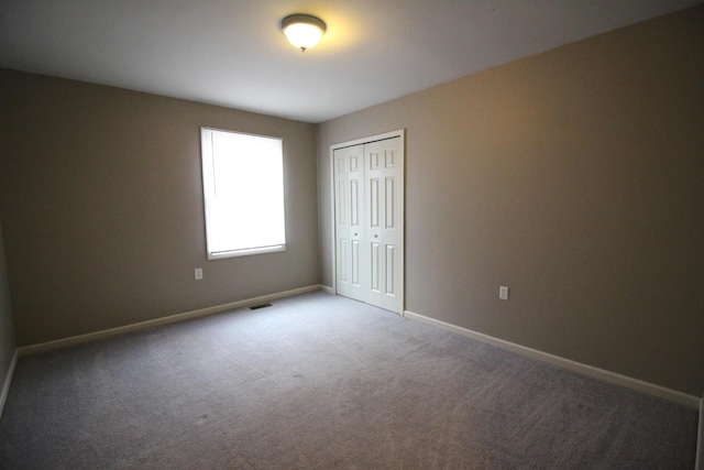 16117 Jackson St, Taylor, MI 48180 - unfurnished bedroom featuring carpet floors, baseboards, and a closet