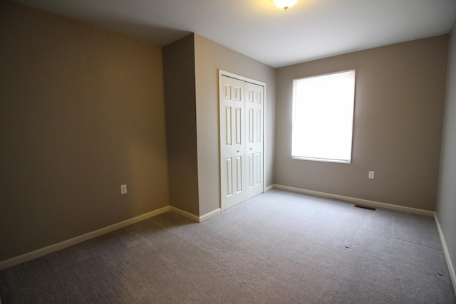 16117 Jackson St, Taylor, MI 48180 - unfurnished bedroom with a closet and light colored carpet