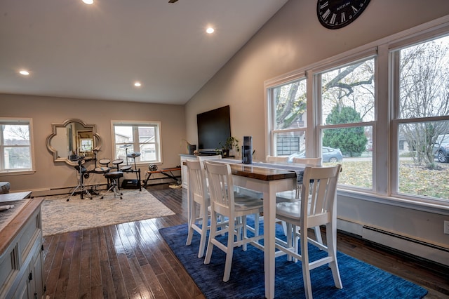 dining area featuring dark hardwood / wood-style flooring, high vaulted ceiling, and a healthy amount of sunlight