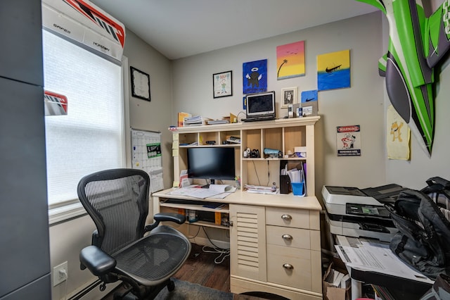 office area with dark hardwood / wood-style floors and a wealth of natural light