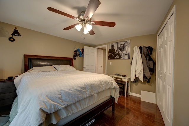 bedroom featuring ceiling fan and dark wood-type flooring