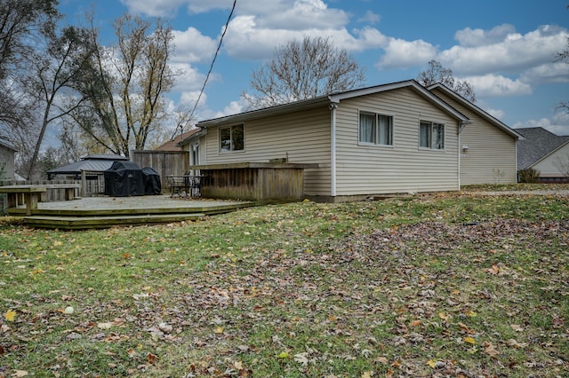 back of property with a wooden deck