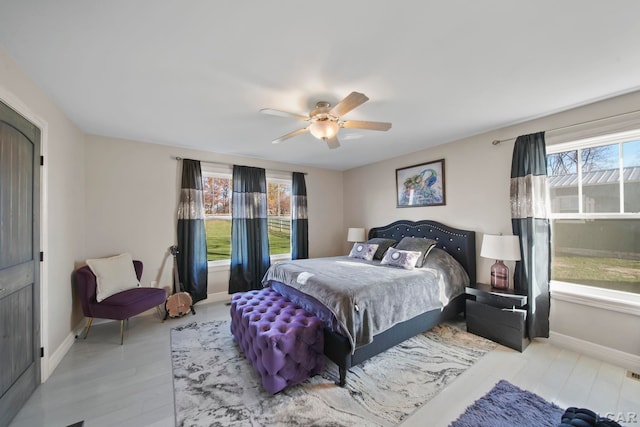 bedroom featuring ceiling fan and light wood-type flooring