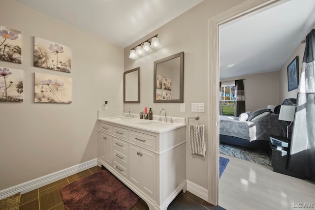 bathroom featuring vanity and wood-type flooring