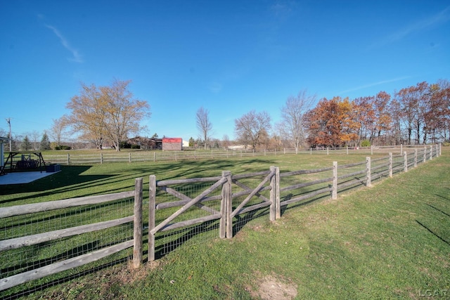 view of yard with a rural view