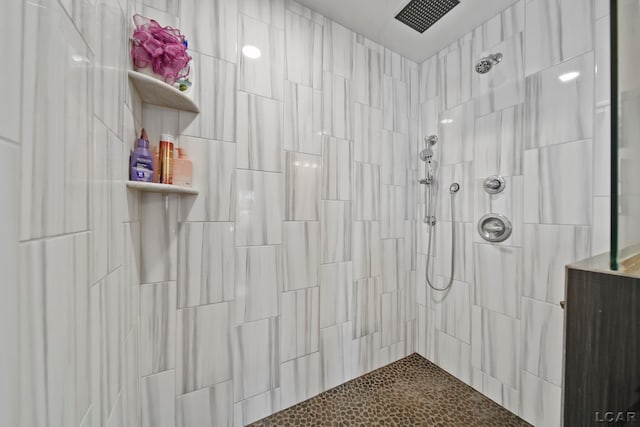 bathroom with tiled shower