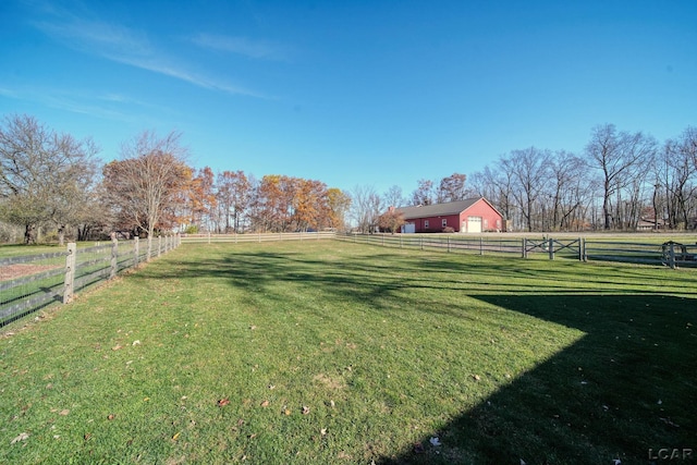 view of yard with a rural view