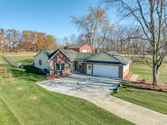 single story home featuring a garage and a front lawn