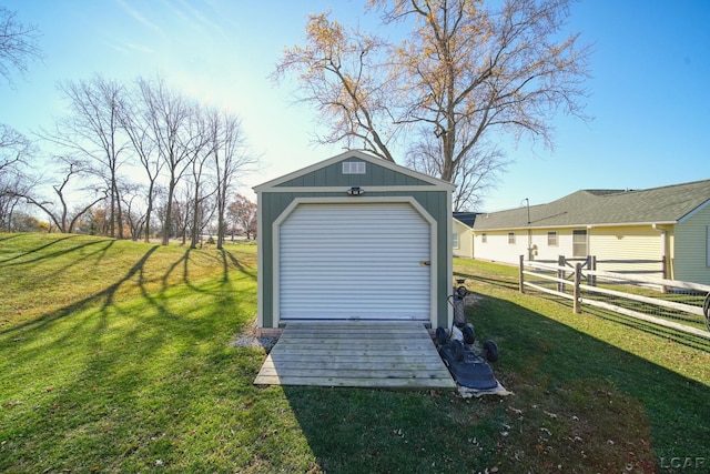 view of outbuilding featuring a lawn