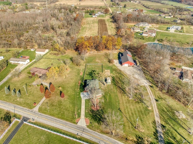 birds eye view of property featuring a rural view