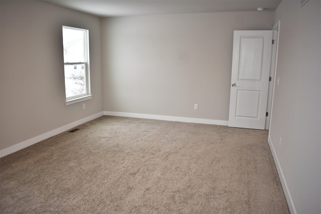 view of carpeted spare room
