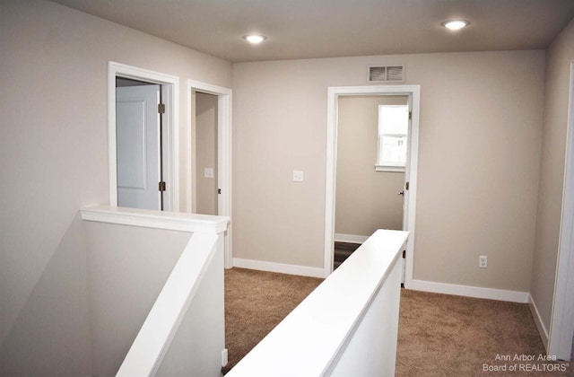 hall with carpet floors