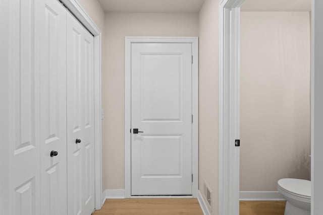 733 Jefferson Ln, Milan, MI 48160 - hallway featuring baseboards and light wood-type flooring
