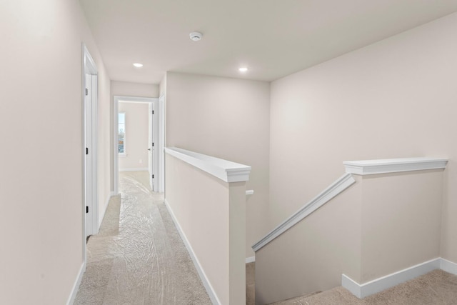 733 Jefferson Ln, Milan, MI 48160 - hall with an upstairs landing, carpet, baseboards, and recessed lighting