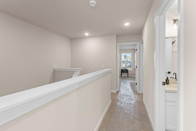 733 Jefferson Ln, Milan, MI 48160 - hall featuring an upstairs landing, light colored carpet, recessed lighting, and baseboards