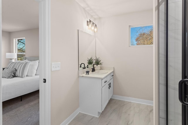 733 Jefferson Ln, Milan, MI 48160 - ensuite bathroom featuring vanity, marble finish flooring, baseboards, and a shower with shower door