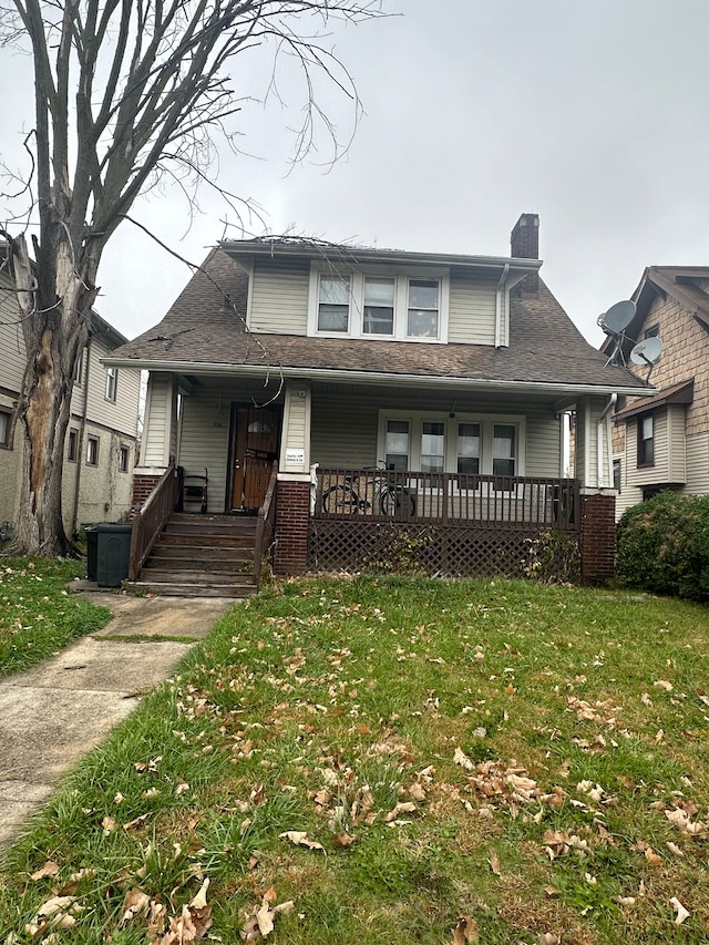 view of front facade with a porch and a front yard