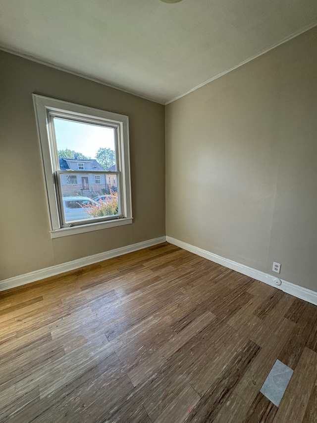 unfurnished room featuring hardwood / wood-style floors