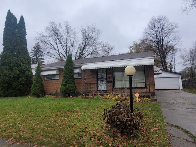 view of front of home with a front lawn and a garage