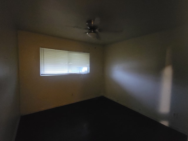 unfurnished room with ceiling fan