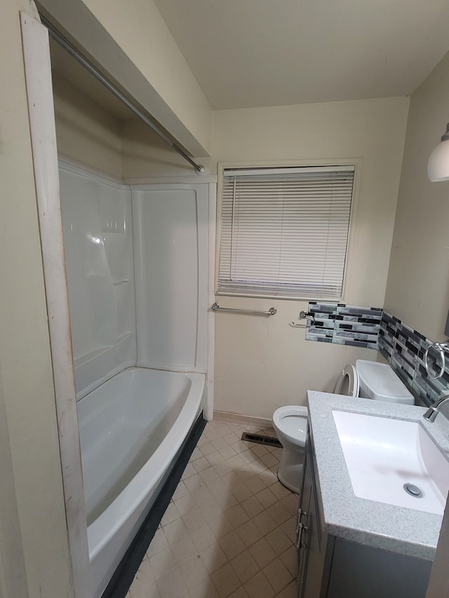 full bathroom with tile patterned flooring, vanity, bathing tub / shower combination, and toilet