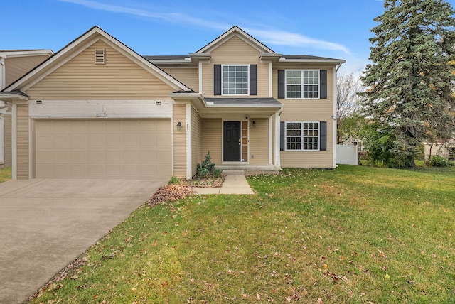 view of front of property featuring a front yard and a garage