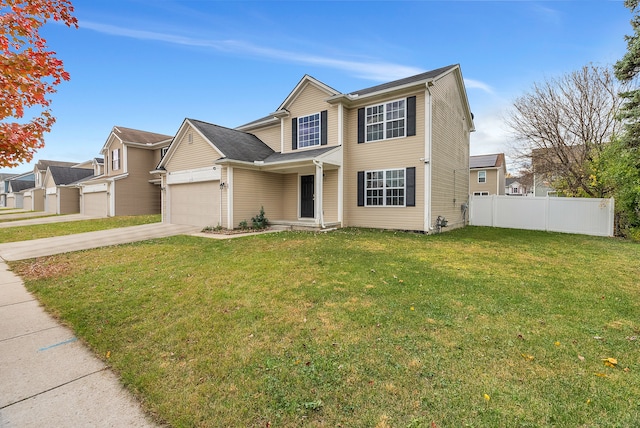 view of front facade featuring a front yard and a garage