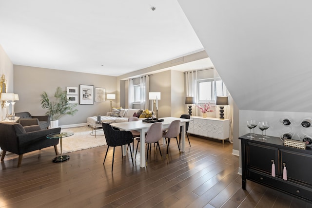 dining area featuring dark hardwood / wood-style floors