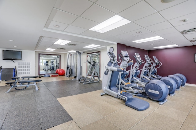 workout area featuring a drop ceiling