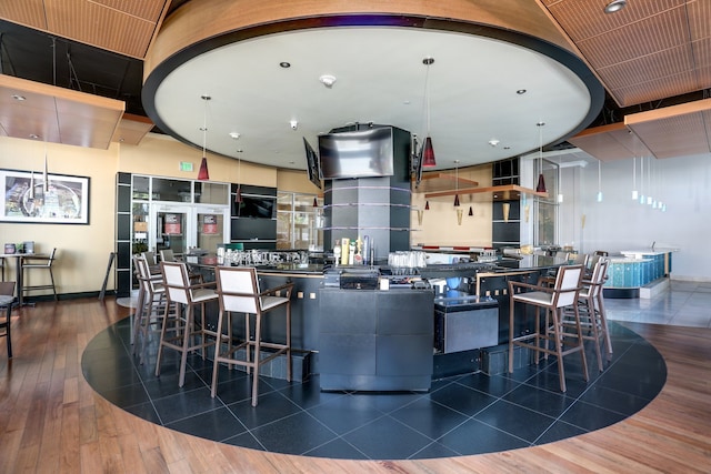 kitchen with pendant lighting and hardwood / wood-style flooring