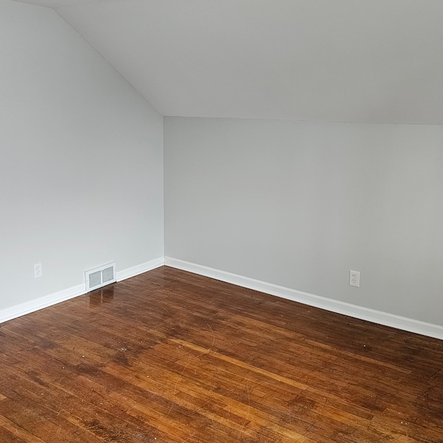 1453 S Merriman Rd, Westland, MI 48186 - spare room with dark wood-type flooring and lofted ceiling