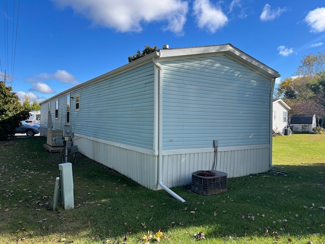 view of property exterior with a yard