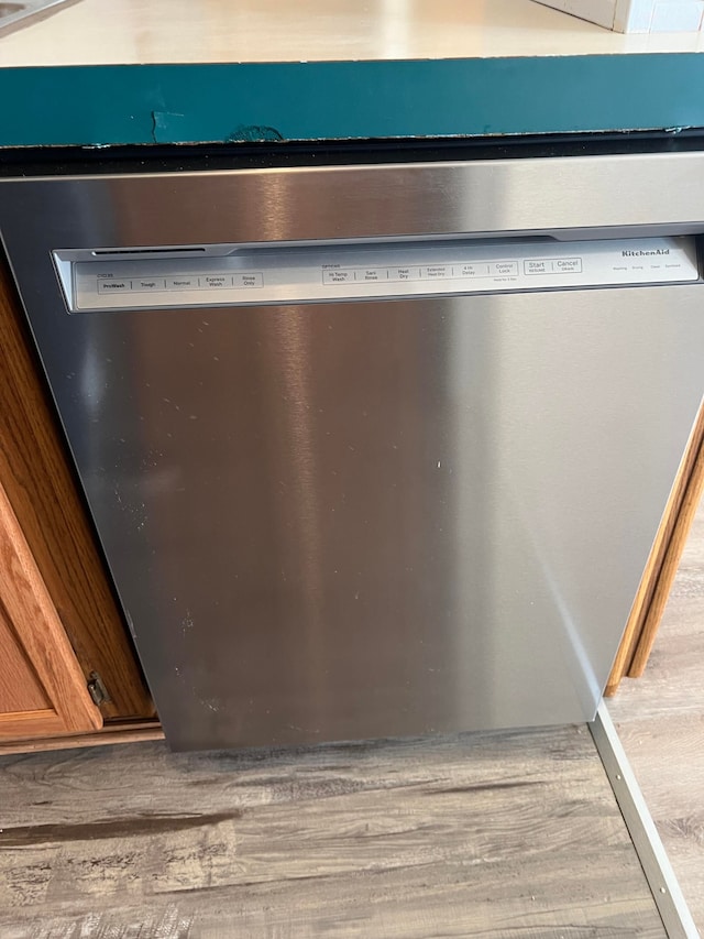 details with hardwood / wood-style floors and dishwasher