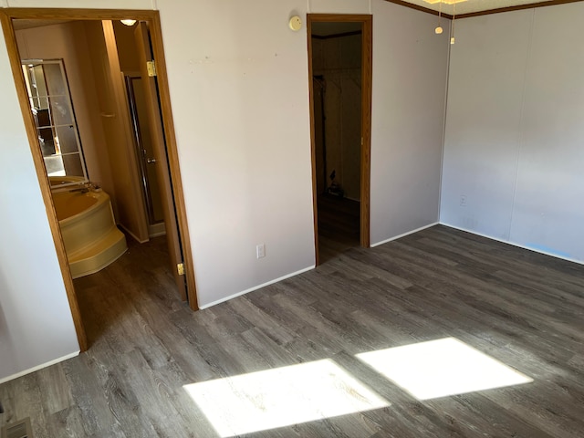 empty room featuring dark hardwood / wood-style flooring