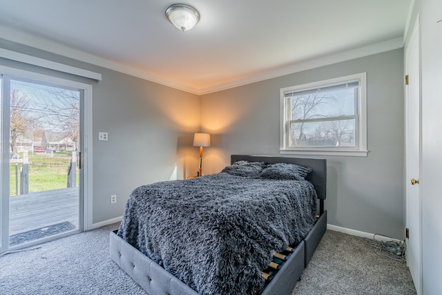 carpeted bedroom with access to outside and crown molding