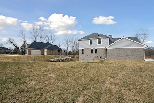 view of side of property featuring brick siding and a yard