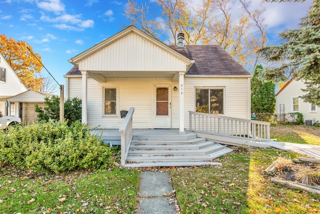 bungalow featuring a wooden deck