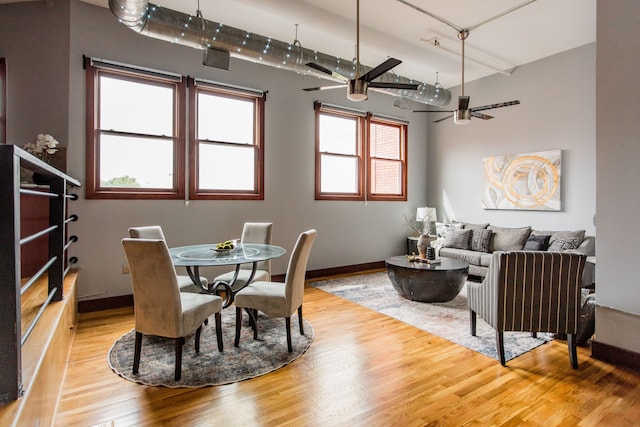 dining space with light wood-type flooring